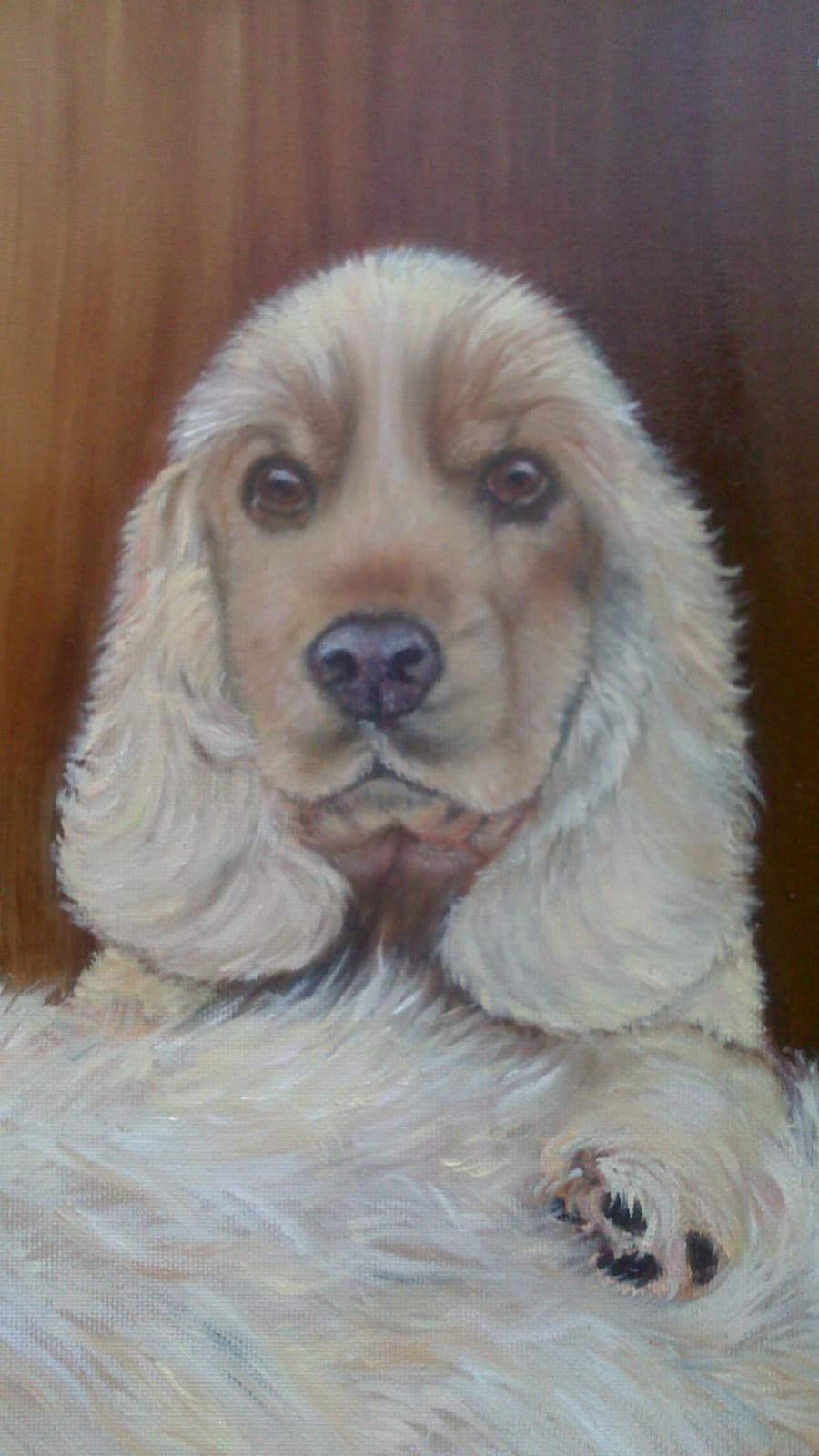 Oil painting of a cream cocker spaniel with long soft ears resting its paw, against a warm brown background